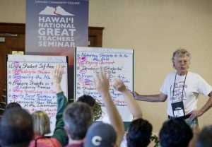 HOLLYN JOHNSON/Tribune-Herald Dave Sherrill takes votes on various breakout discussion topics from attending teachers Wednesday during the Hawaii National Great Teachers Seminar at Kilauea Military Camp in Hawaii Volcanoes National Park.